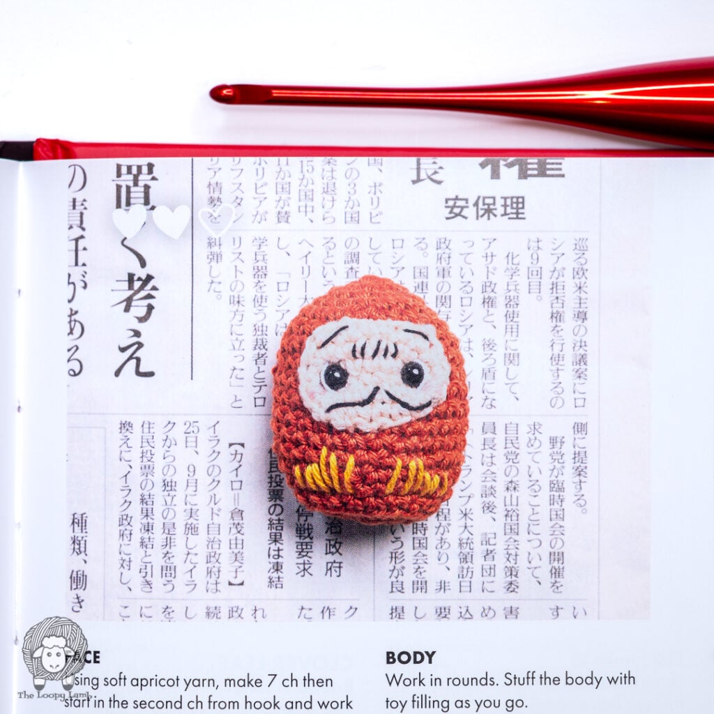 close up image of the daruma toy in the book being reviewed
