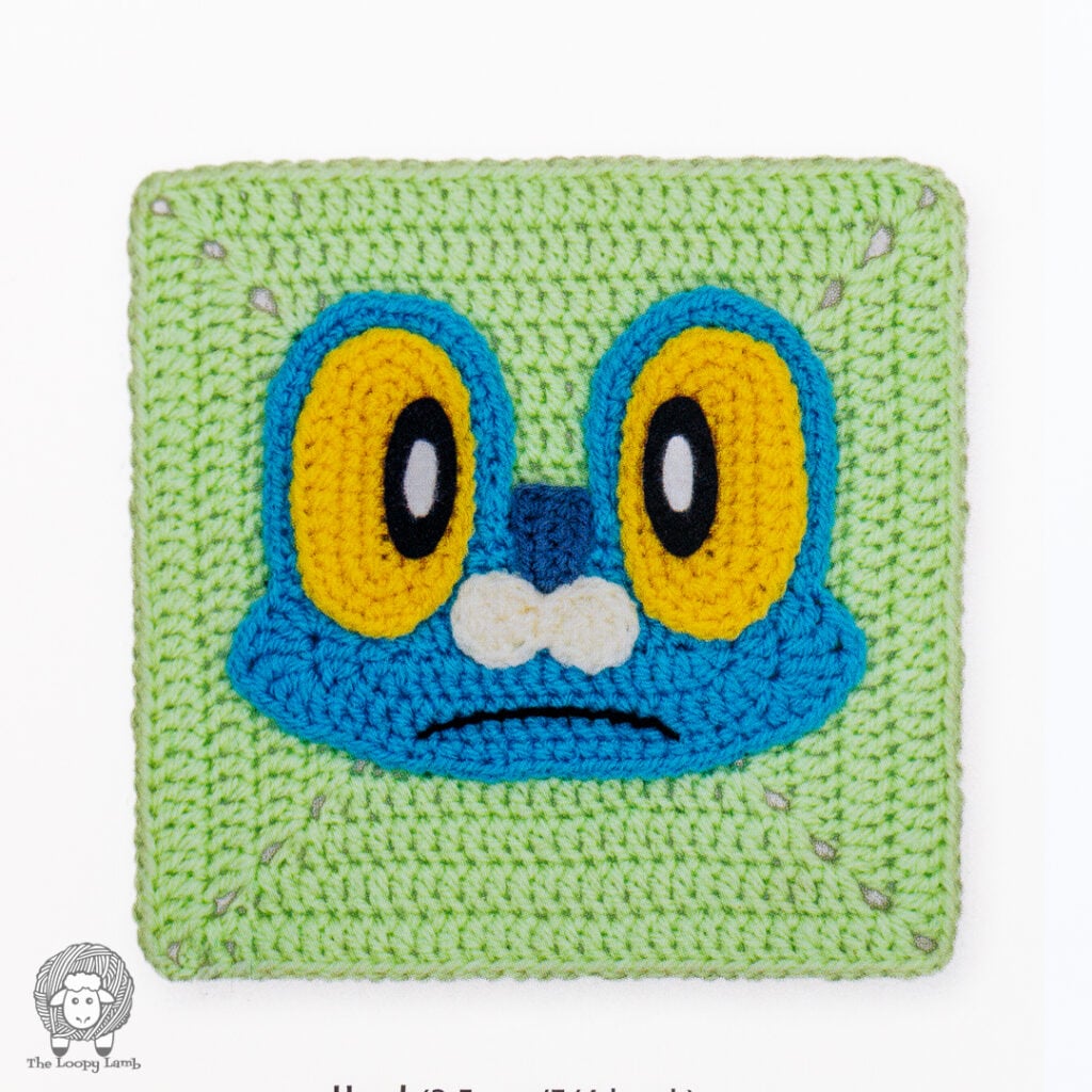 Froakie crochet granny square on a white background from Pokemon Crochet Squares by Ira Rott
