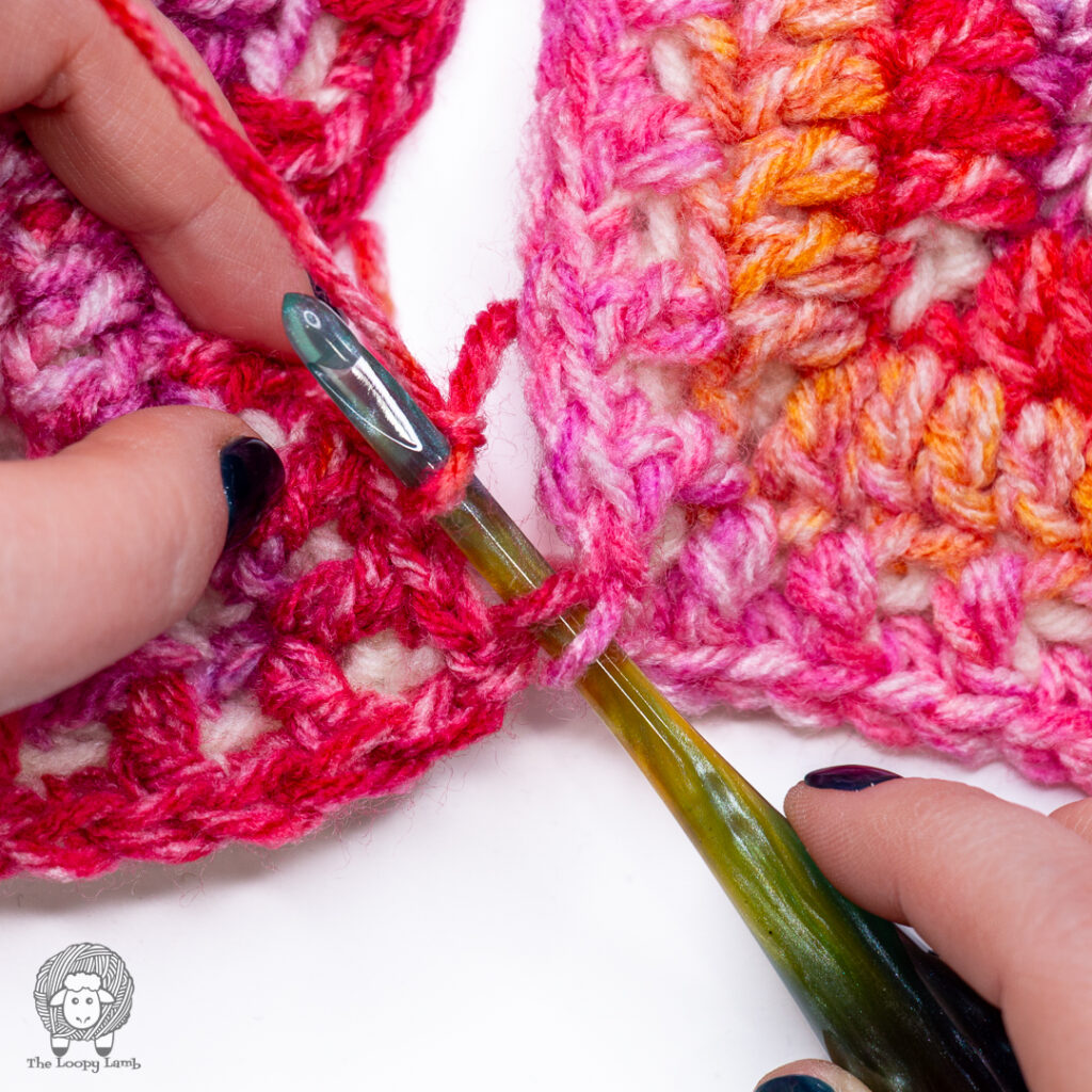 How to join granny squares by inserting hook through the back loops of both squares
