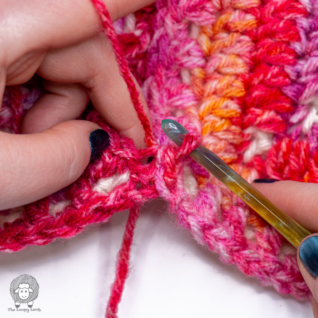 Slip stitching through the back loops to join crochet squares together