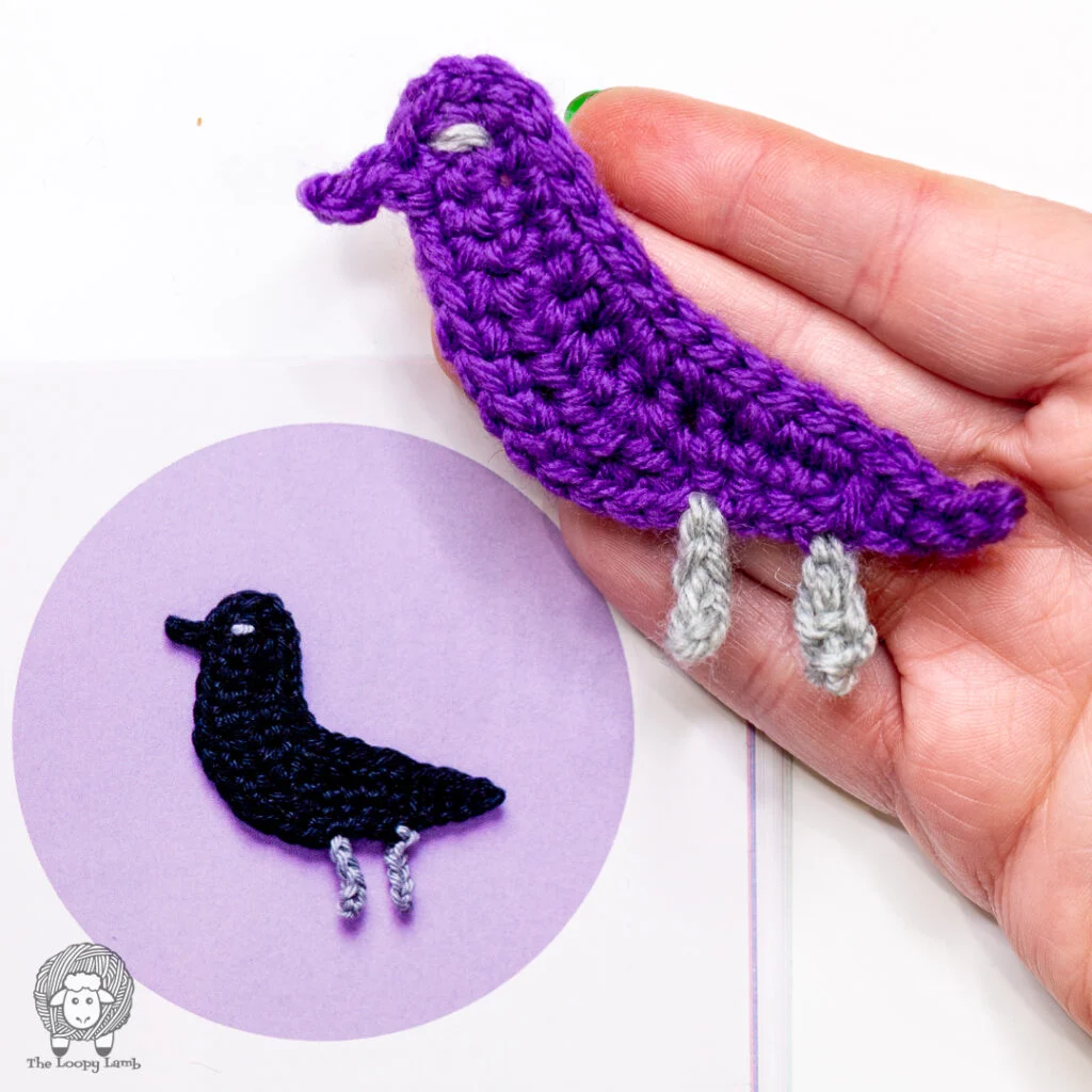 hand holding a crochet raven motif from the book being reviewed