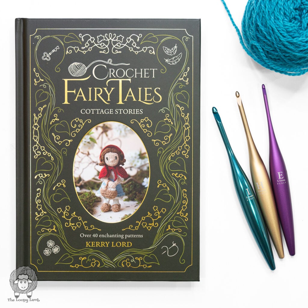 Crochet Fairy Tales Cottage Stories on a white background next to some Furls Crochet hooks