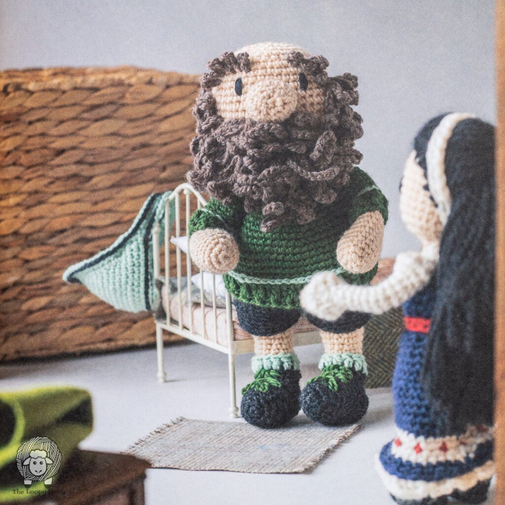 crochet dwarf from Crochet Fairy Tales Cottage Stories next to a bed