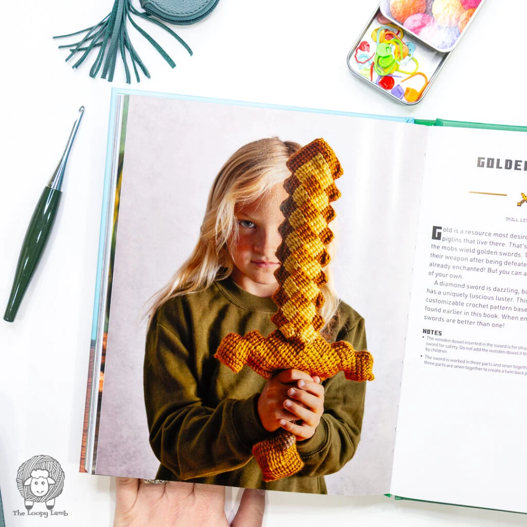 child holding a crochet golden sword from Minecraft: the official crochet book